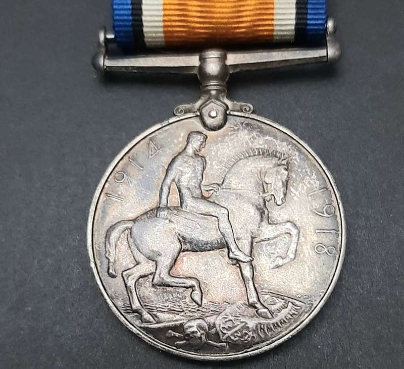 **WW1 UDF: .925 Silver British War Medal w/ Silk Ribbon (4th Dist. Mtd. Rifles).**