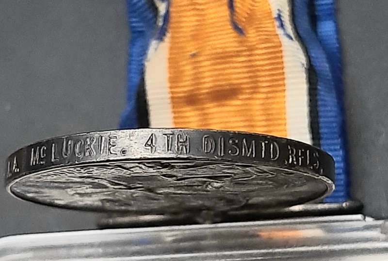 **WW1 UDF: .925 Silver British War Medal w/ Silk Ribbon (4th Dist. Mtd. Rifles).**