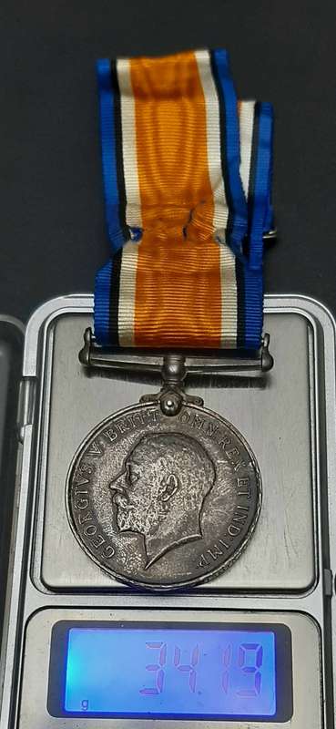 **WW1 UDF: .925 Silver British War Medal w/ Silk Ribbon (4th Dist. Mtd. Rifles).**