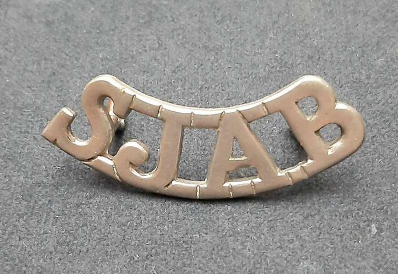 **WW2 St. John Ambulance White Metal Shoulder Title (Lugs Intact).**