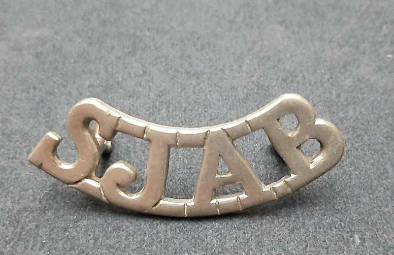 **WW2 St. John Ambulance White Metal Shoulder Title (Lugs Intact).**