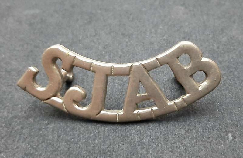 **WW2 St. John Ambulance White Metal Shoulder Title (Lugs Intact).**