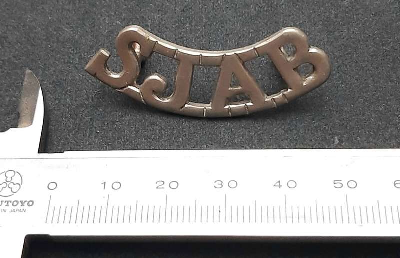 **WW2 St. John Ambulance White Metal Shoulder Title (Lugs Intact).**