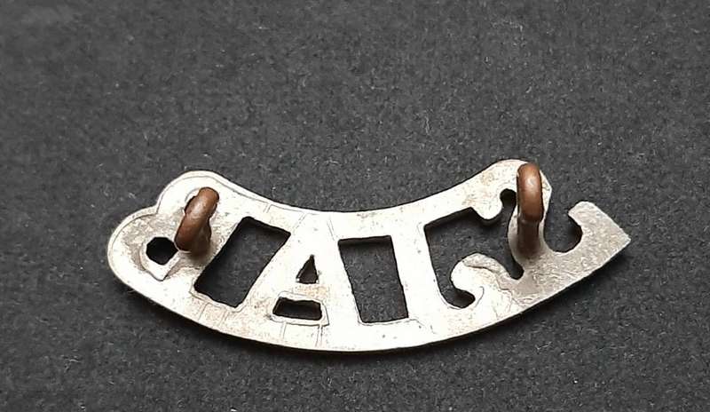 **WW2 St. John Ambulance White Metal Shoulder Title (Lugs Intact).**