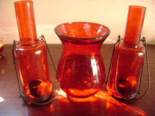 THIS RED GLASS VASE AND TWO CANDLE BOTTLES IN GOOD CONDITION
