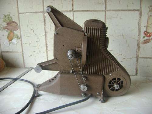 .THIS 8MM UNIVERSAL PROJECTOR- MADE IN THE U.S.A.