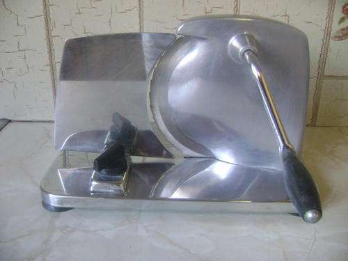 OLD BREAD SLICER IN GOOD CONDITION.
