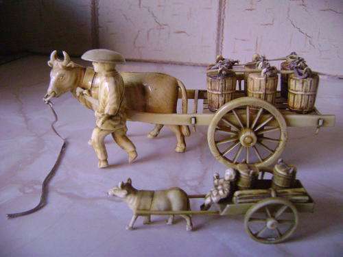 TWO BEAUTIFULLY MADE CARTS DRAWN BY COWS