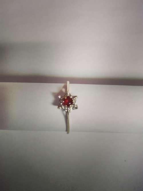 Ladies 9ct gold ring, red gem with diamantes; excluding shipping
