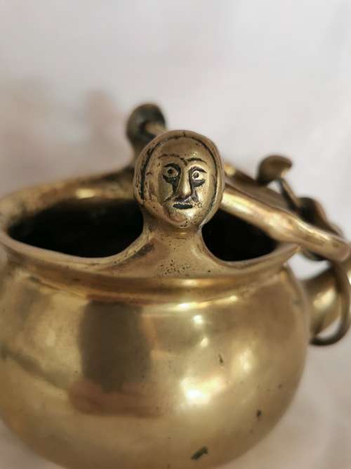 A 16TH CENTURY FLEMISH LEADED BRONZE TWIN-SPOUTED LAVABO, the 16th century way to wash ones hands