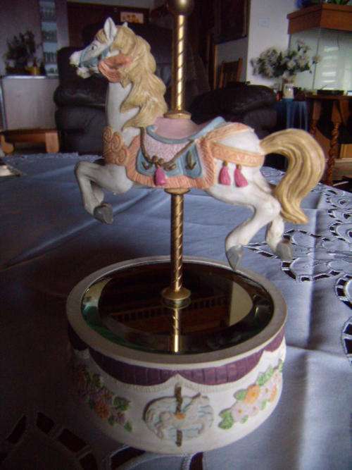 Musical Carousel on a  rotating mirrored platform.