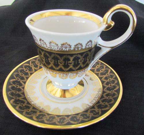 RWk Marque Deposee 5 Footed Demitasse Coffee Cup & Saucer=White ground=Gild & Black pattern =France.