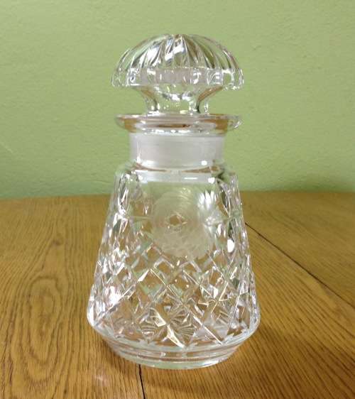 DECANTER=CUT GLASS DECANTER=TAPERED ROUND=EXCELLENT CONDITION=ROSE PATTERN ENGRAVING.