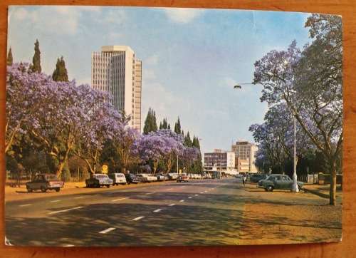POSTCARD=POST CARD=RHODESIA=LIVINGSTONE HOUSE=MOFFAT STREET=SALISBURY=JACARANDA=1978=HARARE=ZIMBABWE