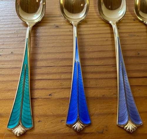 STERLING SILVER GILT & ENAMEL TEASPOONS x 6 SUGAR SPOON x 1 DAVID ANDERSEN NORWAY RADHUS PATTERN.