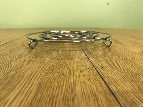 TRIVET  CHROME PLATED ROUND.