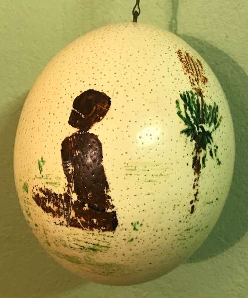 OSTRICH EGG PAINTED with a HANGING CHAIN.