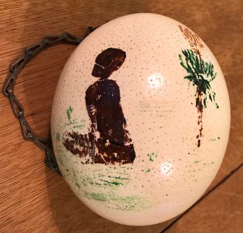 OSTRICH EGG PAINTED with a HANGING CHAIN.