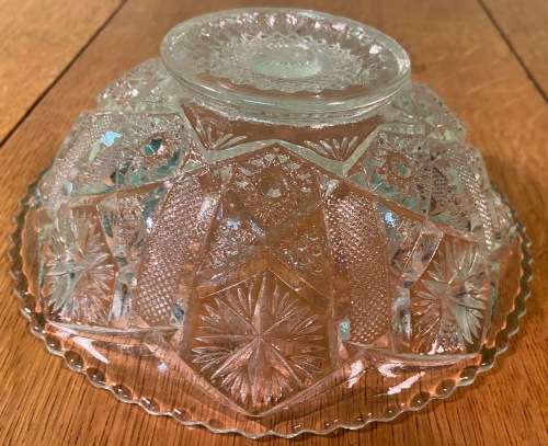 GLASS BOWL SMALL with pressed STAR SHAPED PATTERNS.