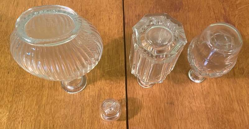 GLASS VASES / BOTTLES x 4 - possibly perfume bottles without stoppers.
