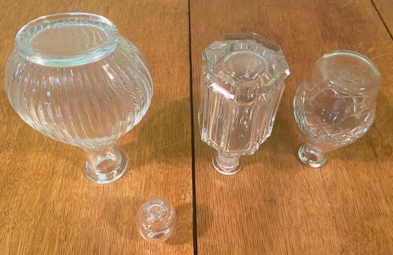 GLASS VASES / BOTTLES x 4 - possibly perfume bottles without stoppers.