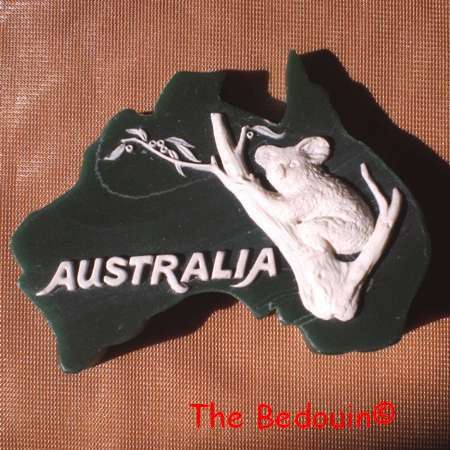 PAPERWEIGHT (AUSTRALIA). Cultured Marble shape of Australia with Koala Image. 'Marlestone.'
