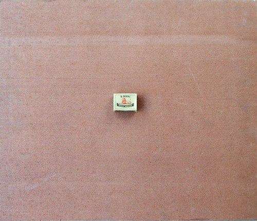 from behind and with a match box