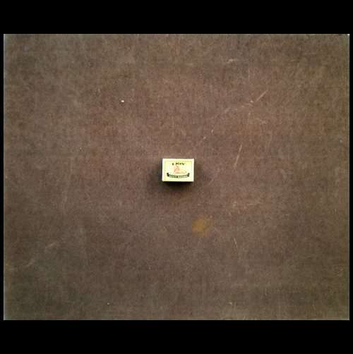 from behind and with a match box