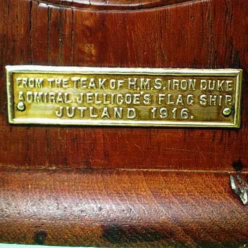 BRASS PLATE ON ONE BOOKEND.