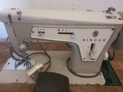 Electric Singer Sewing Machine in Antique Cabinet