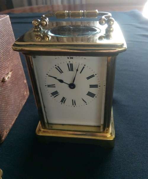 ANTIQUE FRENCH BRASS CARRIAGE CLOCK IN ORIGINAL CASE AND HAS ORIGINAL KEY