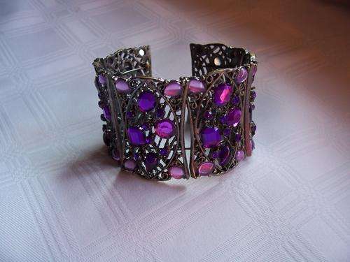 Metal bracelet with pink and purple stones