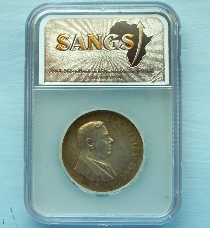 1967 SILVER PROTEA ONE RAND. GRADED MS 61. AFRIKAANS.