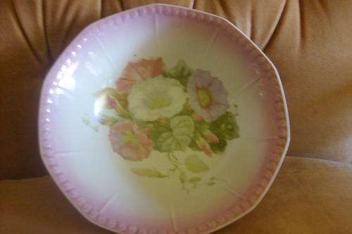 This is a lovely pink bowl with flower detail stamped D at the bottom