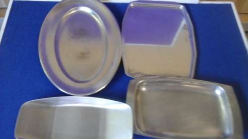 A TERRIFIC ASSORTMENT OF FOUR STAINLESS STEEL SERVING TRAYS. AWESOME & USEFUL PIECES!