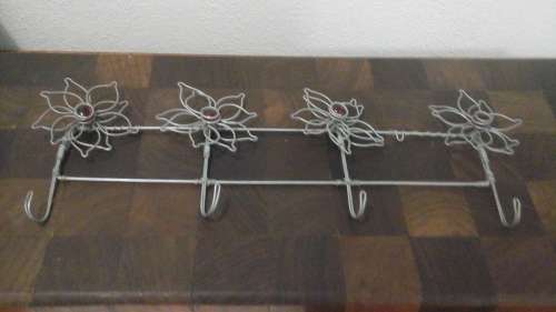 MAGNIFICENT AND UNUSUAL. LIKE WIRE ART WELL THIS WIRE COAT HOOK WITH FLORAL DECORATION IS FANTASTIC