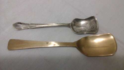 TWO MAGNIFICENT VINTAGE SUGAR SCOOPS. ONE IS EPNS AND THE OTHER IS BRASS. HIGHLY COLLECTIBLE