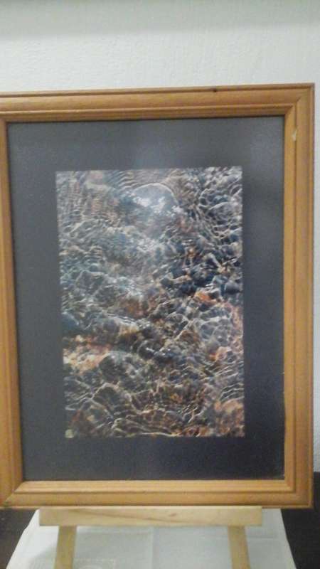 A PHOTOGRAPH NAMED RIPPLES BY M VAN STAATEN. BUY IT JUST FOR THE FANTASTIC WOODEN FRAME.