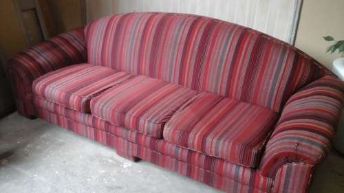 A NICE TATTY COUCH. USE IT IN THE KIDS LOUNGE OR AS A RESTORATION PROJECT.
