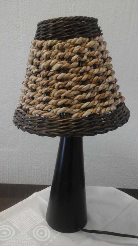 CALL IT A MUSHROOM LAMP. THIS FANTASTIC LOOKING RESIN LAMP WITH A WOVEN SHADE IN VERY INTERESTING