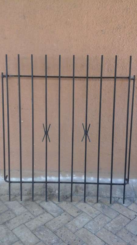 KEEP YOUR HOME SECURE. FANTASTIC SPANISH STYLE BURGLAR BAR. GIVE YOU SLIGHT MORE PEACE OF MIND!