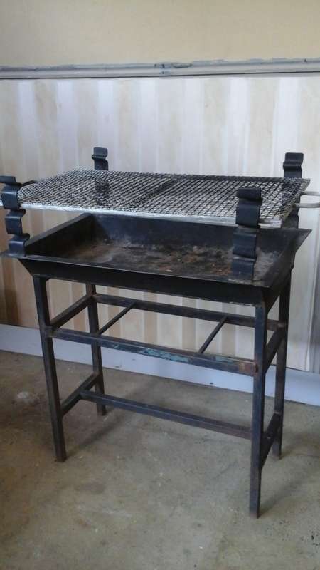 WOW A FANTASTIC ADJUSTABLE STEEL BRAAI. ITS PORTABLE MOVE IT WHEREVER YOU WANT