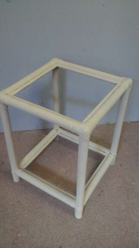 A STUNNING VINTAGE CHALK PAINTED SQUARE  CANE/RATTAN COFFEE TABLE. HAS A GLASS TOP AND A GLASS SHELF
