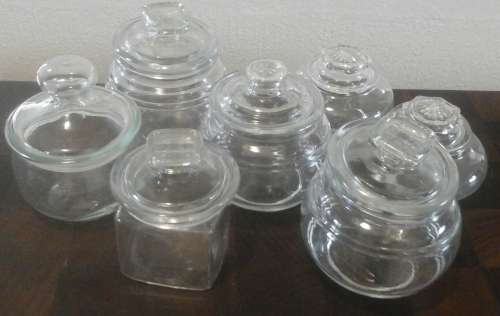 A FANTASTIC AND HANDY COLLECTION OF SEVEN STORAGE JARS. ALL HAVE LIDS