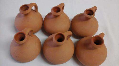 CHARACTER FILLED LITTLE TERRACOTTA POTTERY JUGS. USEFUL AND PRACTICAL