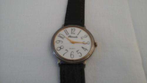 Stylish vintage Gents Slimline Renato Quartz watch.  Has a leather strap and a stainless steel back