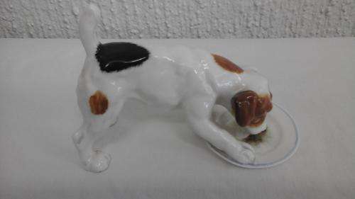 MAGNIFICENT VINTAGE ROYAL DOULTON FIGURINE OF PUPPY LICKING DISH. MADE IN ENGLAND. ADORABLE!