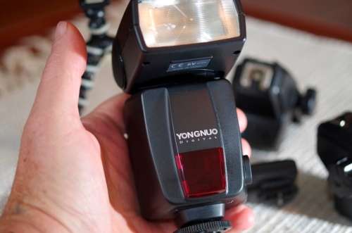 Yongnuo speedlite and one sender with two recievers for off camera flash mounting.