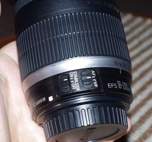 Canon 18-200 IS lens, comes with caps, photos show exact item on sale.
