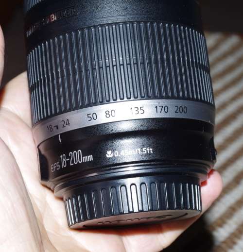Canon 18-200 IS lens, comes with caps, photos show exact item on sale.